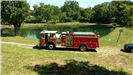 Fire truck parked by a lake