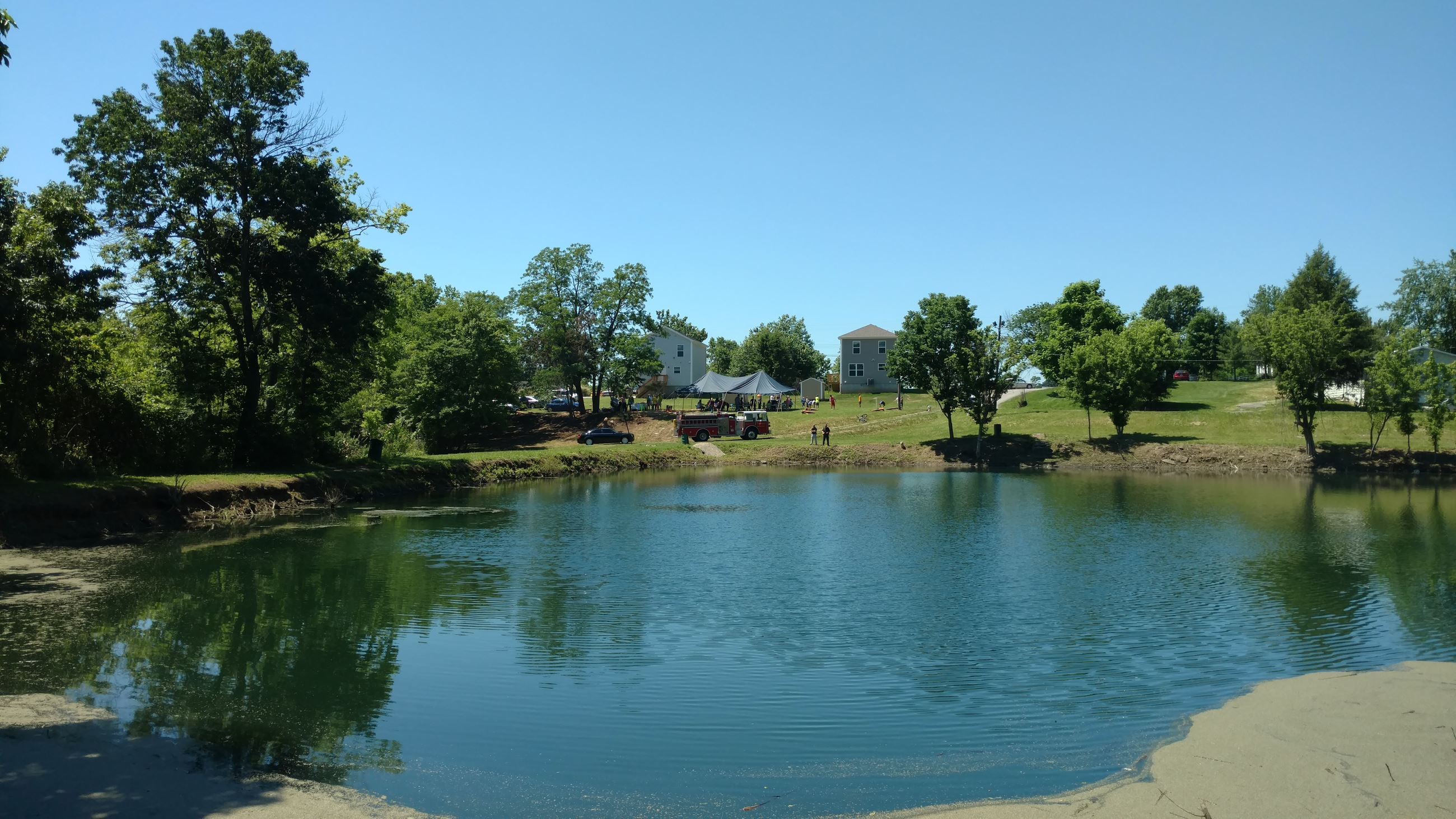 View of community cookout from across the lake