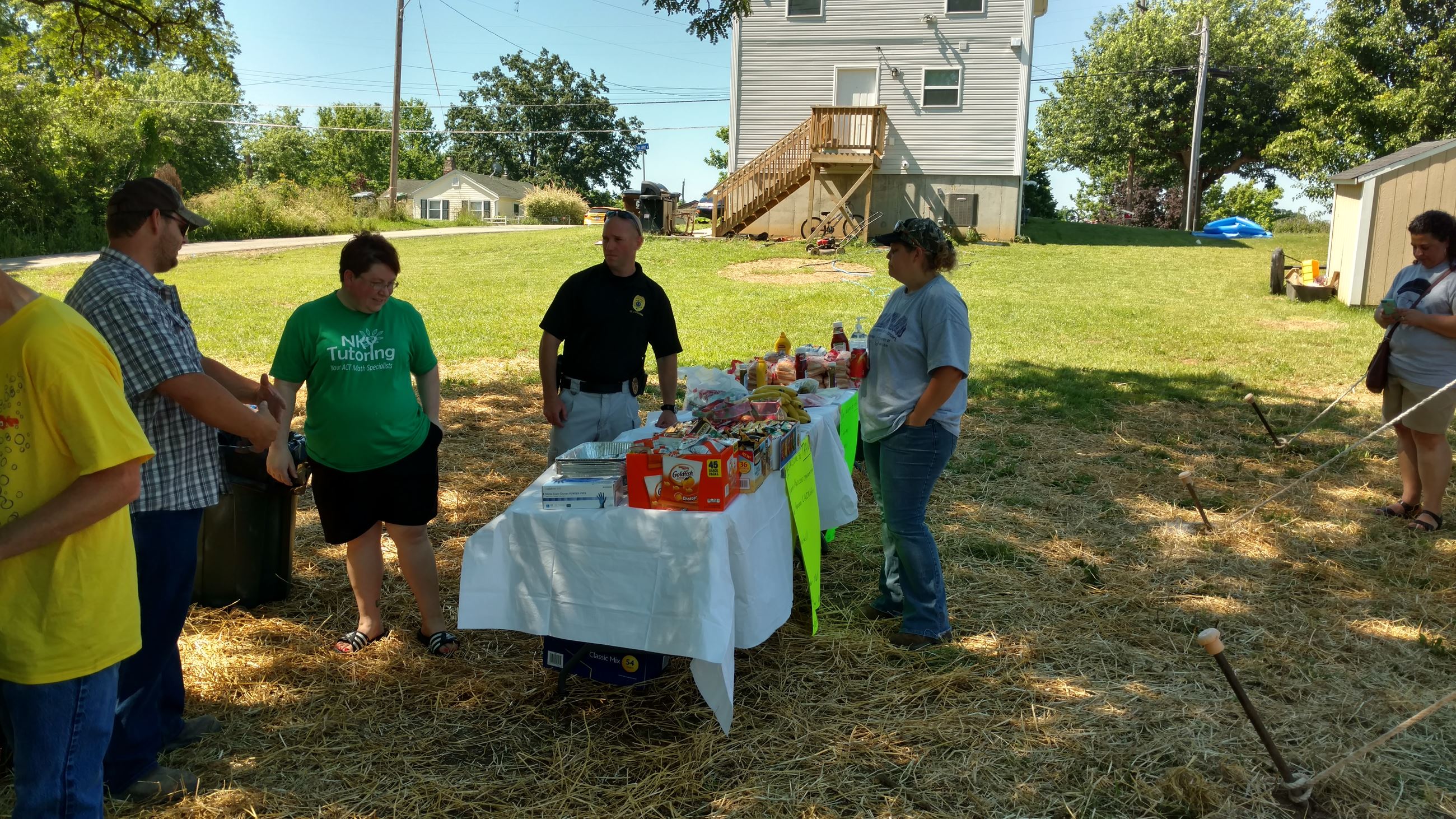 People talking by food table