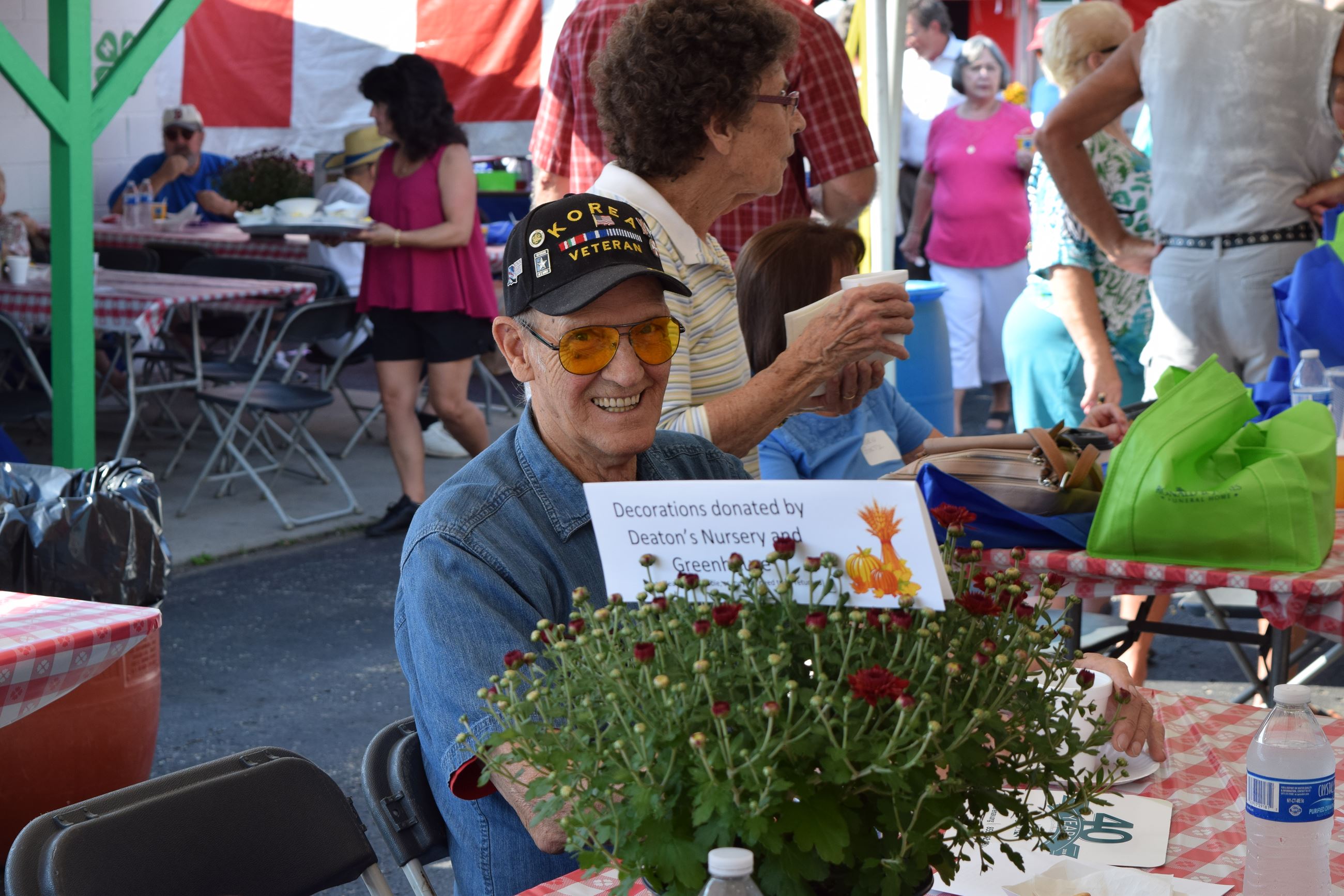 Man wearing "Korea Veteran" cap smiling