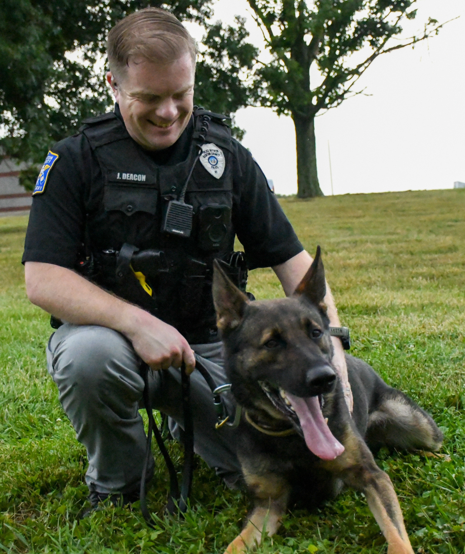 Officer Deacon looking down at K9 officer Ronin