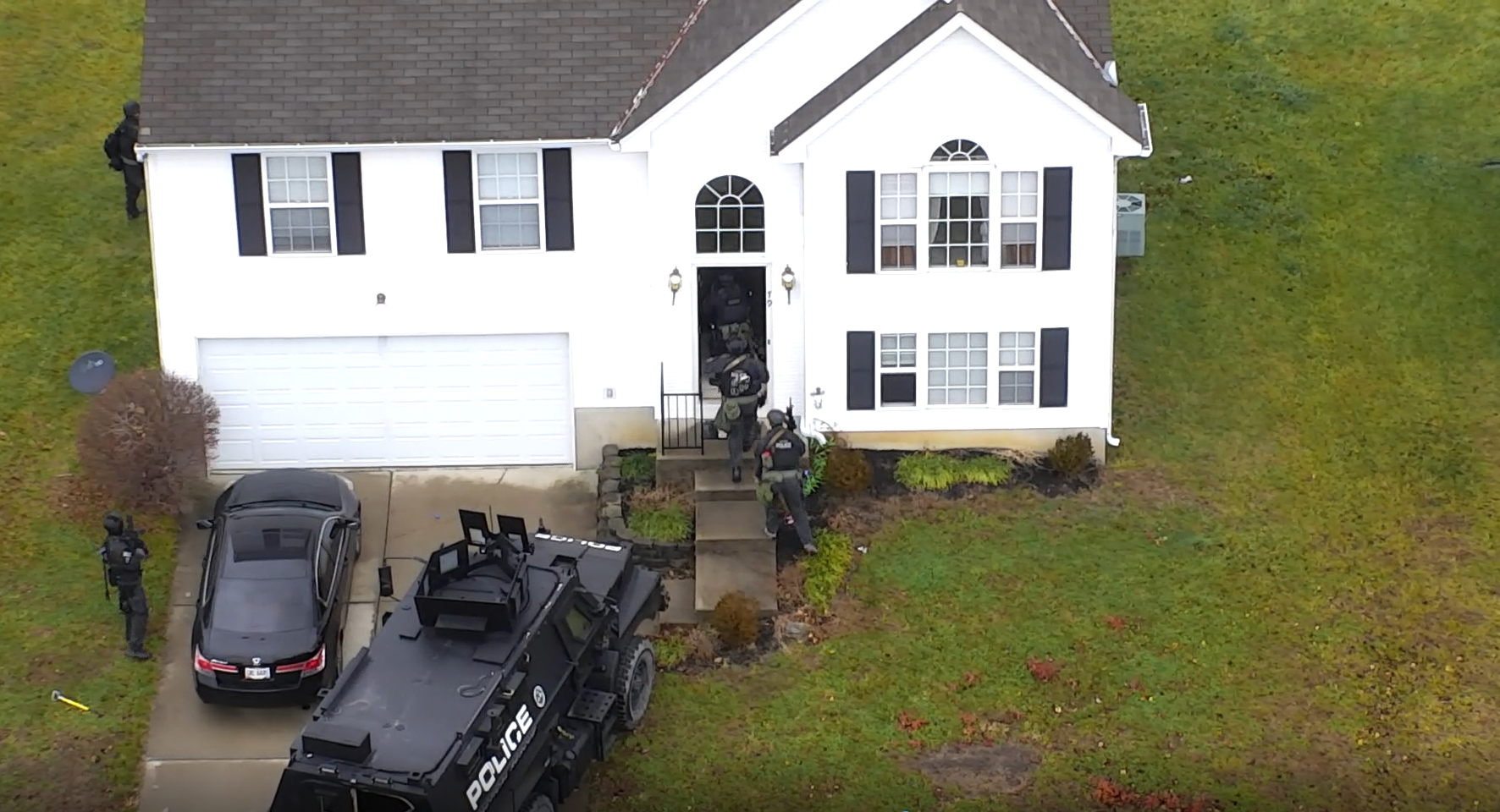 SWAT enters a house.